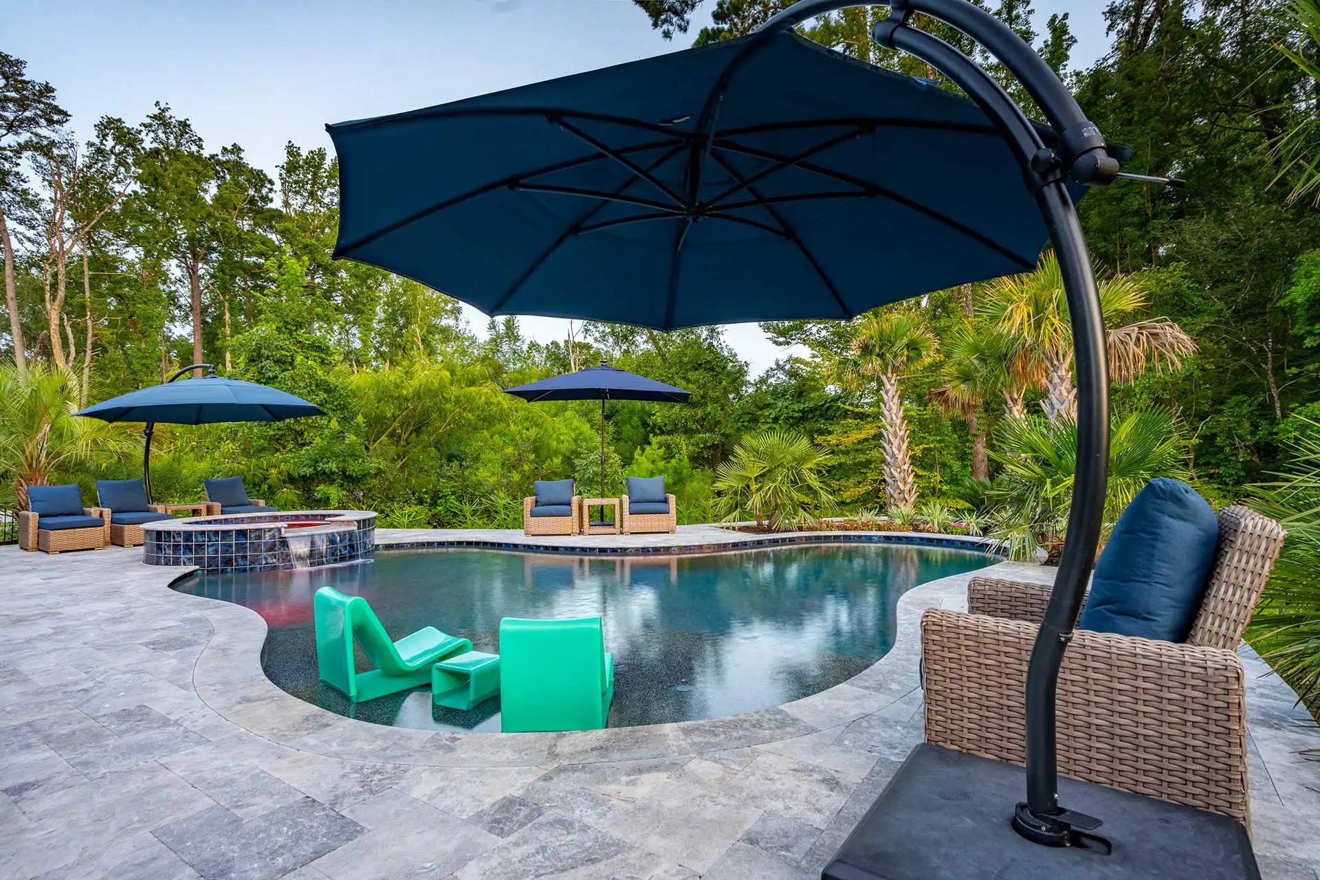 Freeform lagoon with travertine, Heritage Pools project